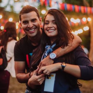 man-wearing-t-shirt-hugging-woman-manifesting-love Man wearing t-shirt hugging woman manifesting love.