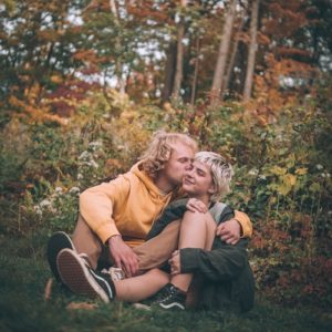 Woman manifesting love with her boyfriend kissing her forehead Woman manifesting love with her boyfriend kissing her forehead